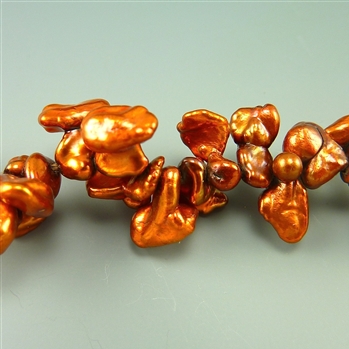 12mm burnt orange fresh water top drilled keshi pearls, one strand