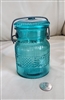 Avon blue glass jar with wire closure storage