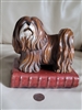 large ceramic lhasa apso dog standing on a book bookend 1970s