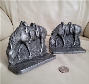 set of vintage cast metal saddled western horse bookends