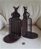 vintage Pier 1 metal birdcage bookends with gold tone bird toppers