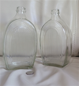 Hand blown clear glass bottles with ribbed side