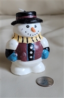 Colorful snowman wax candle