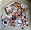 Open deck of Star Wars The Mandalorian playing cards spread out next to their original box and a coin marker for scale reference