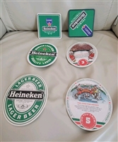A set of six reversible Heineken beer mats showing both the logo side and the hockey trivia reverse side