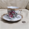 Large porcelain mustache cup and saucer floral