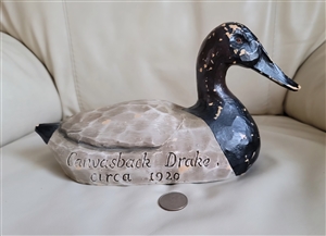 Side view of Canvasback Drake duck decoy replica with engraved text and composite body
Top view showing weathered paint finish on vintage style duck decoy display