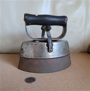 Vintage antique sad iron with a removable wooden handle for display