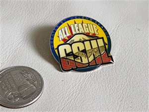 Front view of colorful 2000s Greater St Helens League GSHL All League high school sports award pin next to coin