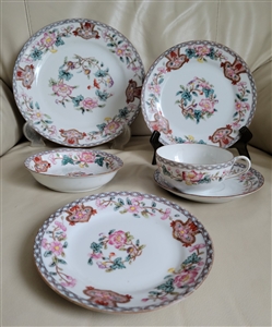 Antique Noritake Berkeley 1912 six piece porcelain place setting featuring hand painted floral designs and geometric borders on plates and teacup