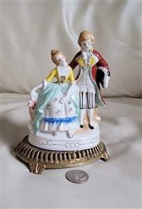 C and S New York porcelain figures on a pedestal