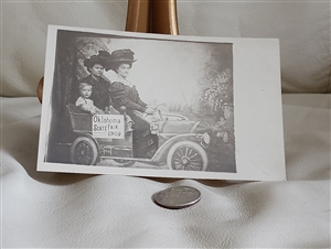 Antique 1907 real photo postcard of Oklahoma State Fair with family in an early car