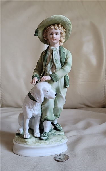 Andrea by Sadek, Japan, porcelain boy with a dog figure, 9-1/2 tall.