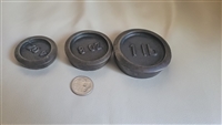 Three cast metal round scale weights 1lb 8oz 4oz