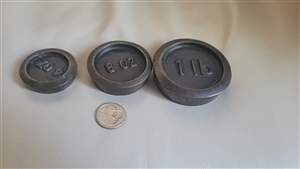 Three cast metal round scale weights 1lb 8oz 4oz merchant scales daily use and collectible items