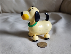 Vintage dog toy plays music and barks