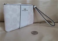 New old stock Coach signature coated canvas wristlet with retail tags and white leather trim
