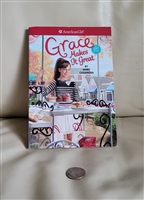 Front cover of American Girl book Grace Makes It Great showing a girl with a pastry cart
