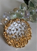 Flaring sun brooch with amazing clear stone decor
