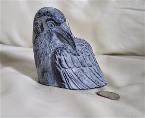 Hand sculpted gray beeswax crow candle by Big Dipper Wax Works