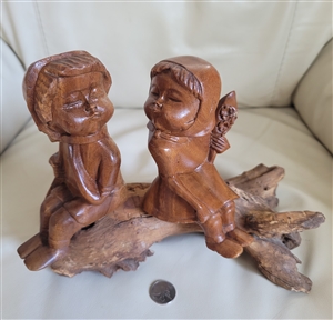 Unique Folk Art wood carving of a boy and a girl