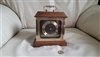1980s Hamilton West German quartz bracket mantel clock with dark wood case and brass handle preowned vintage sells as is