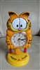 Garfield standing alarm clock swinging pendulum