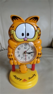 Garfield standing alarm clock swinging pendulum