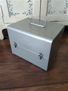 Vintage Brumberger 8mm film reel metal storage case with twelve slots and top handle