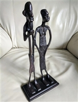 Cast metal African tribal men and women statue