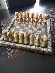 Aztec symbols Chess game board with ceramic pawns