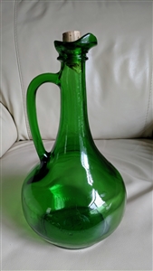 Vintage 1976 emerald green glass one and a half liter wine decanter with a long neck, ruffled pouring lip, and integrated handle