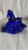 Deep cobalt blue glass rocking horse candle holder