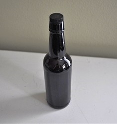 Vintage brown glass bottle with cork stopper for collectible storage and home decor