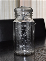 wide mouth glass jar with lid and wire bail