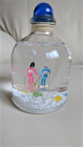 Snow globe glass bottle winter skiing theme