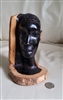 Vintage African tribal hand carved woman's head in multi color design..