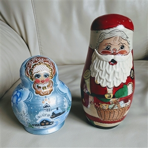 Hand painted wooden Santa and Mrs Claus single nesting doll figures