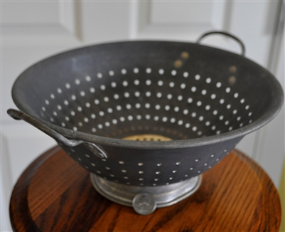 Vintage aluminum colander storage display