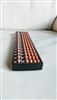 Vintage 17-digit plastic Soroban abacus with light brown beads and a black frame for display