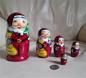 Handcrafted vintage wooden Santa Claus nesting dolls set of five figures