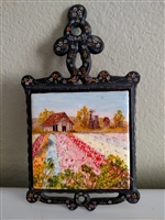 Vintage trivet with hand painted decorative tile