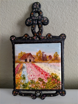 Vintage trivet with hand painted decorative tile