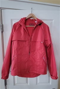 Red Levi Strauss & Co outdoor adventure women's hooded cycling jacket with reflective accents and back pocket
