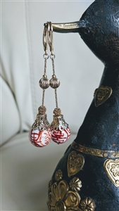 Long dangle gold tone earrings porcelain bead