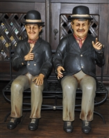 Laurel and Hardy figures sitting on the bench