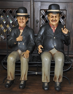 Laurel and Hardy figures sitting on the bench
