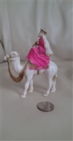 Vintage celluloid plastic merchant on a camel