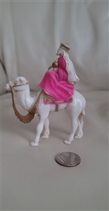 Vintage celluloid plastic merchant on a camel