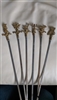Beautiful vintage skewers set of 6 Brass tops Mythical Figurines Gods with metal ends.